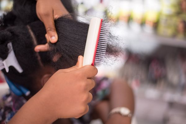 Detangling coily hair section by section