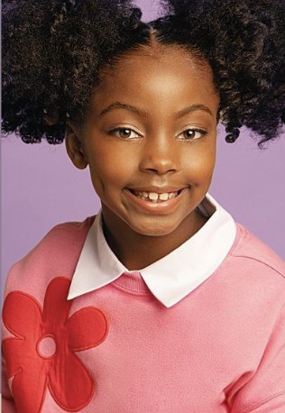 Girl in a pink sweater with a white collar