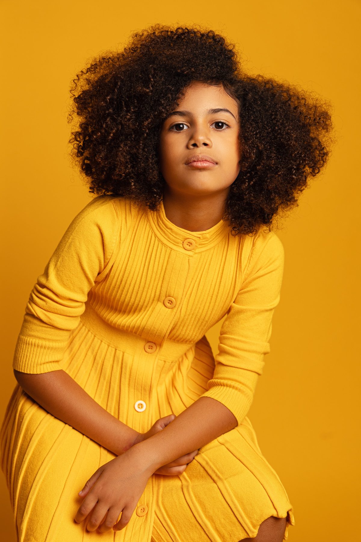 Girl in a mustard knit dress